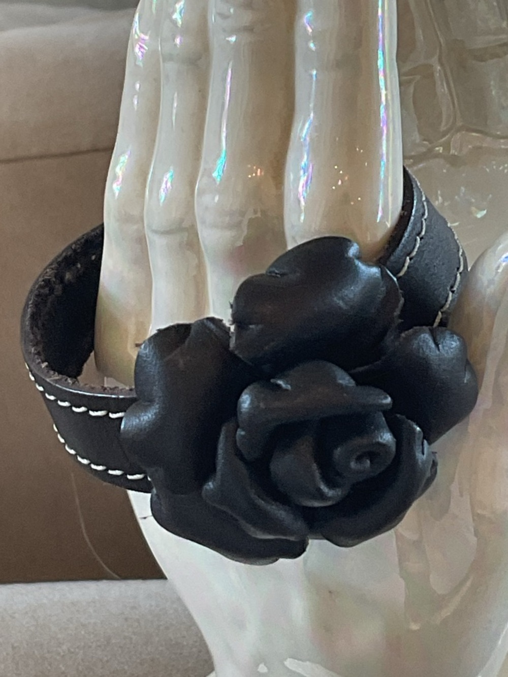 Black Fashion Jewelry Rose Cuff Bracelet with contrasting stitching.